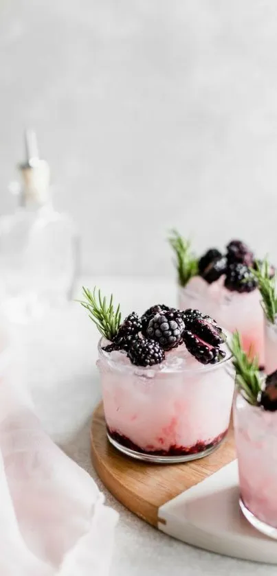 Pink frosty blackberry cocktail with rosemary.