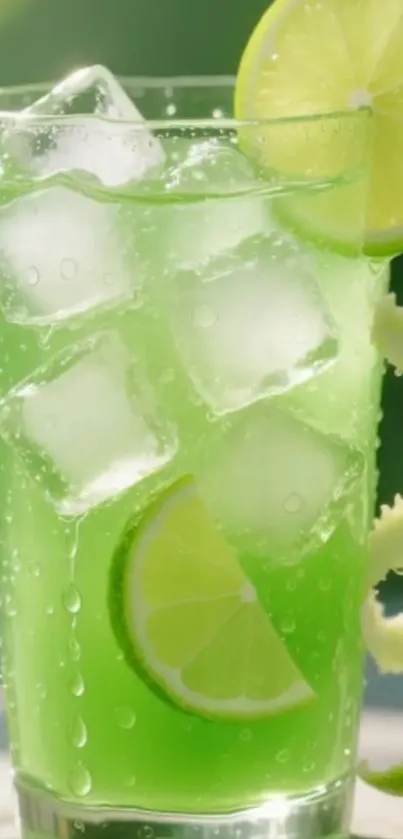 A vibrant green lime beverage with ice cubes and lime slices.