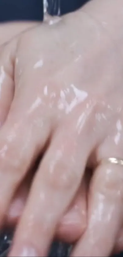 Close-up of hands under running water, emphasizing cleanliness and hygiene.