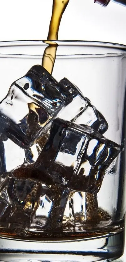 Pouring drink over ice cubes in a glass.