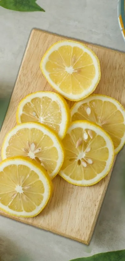 Mobile wallpaper featuring fresh lemon slices on a wooden board.