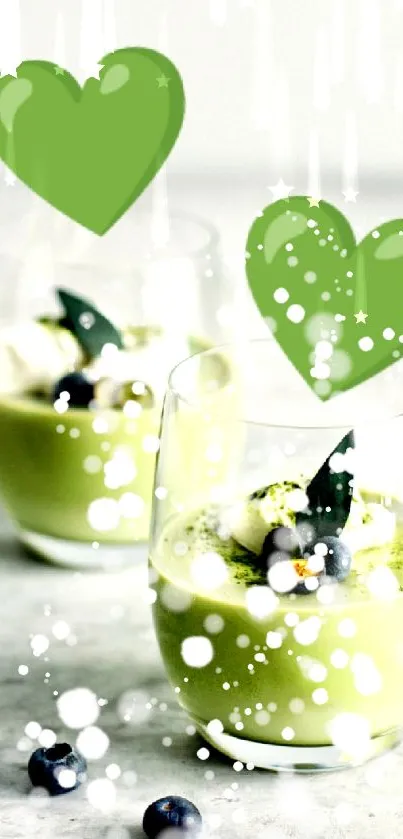 Matcha drink with green hearts and blueberries on mobile wallpaper.