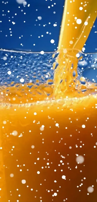 Orange juice splash with bubbles against blue backdrop.