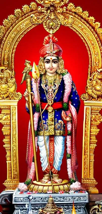 Hindu deity in ornate gold frame with striking red background.