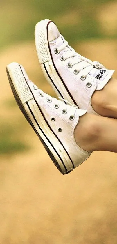 Casual summer drive with sneakers out the car window.