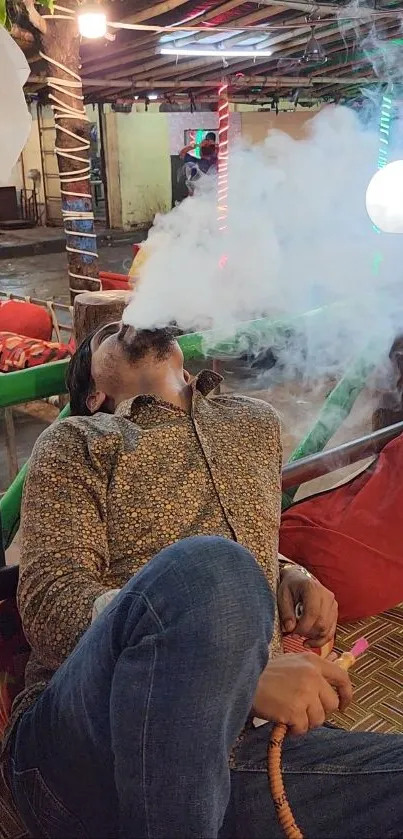 Person relaxing in lounge with hookah amid atmospheric smoke.