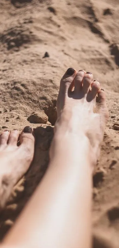 Feet relaxing on sandy beach with warm sunlit tones, perfect for summer vibes.