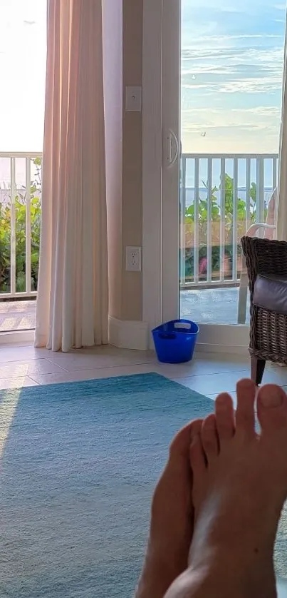 Relaxing ocean view from a sunlit room with open balcony doors.