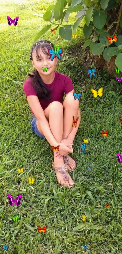 Young girl sitting on grass in a garden.