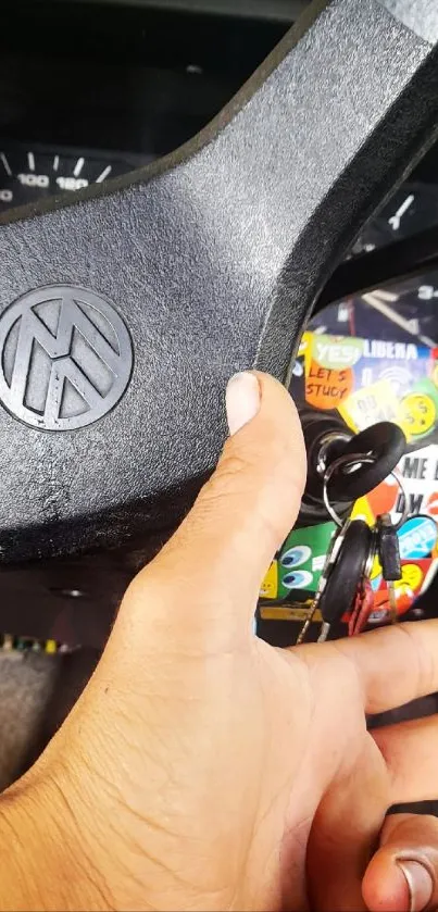 Close-up of a vintage car steering wheel and dashboard with keys.