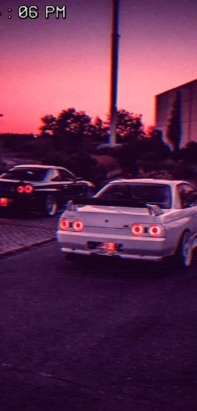 Retro cars parked at sunset with vibrant purple hue.