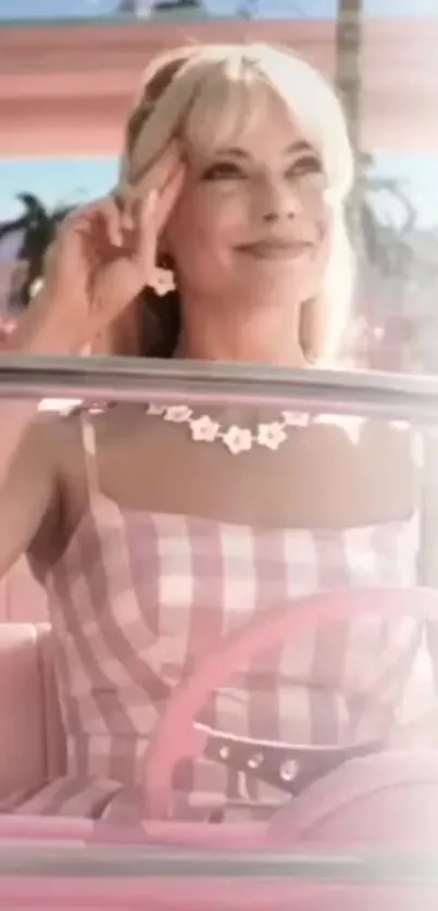 Smiling woman in pink retro car with floral accents.