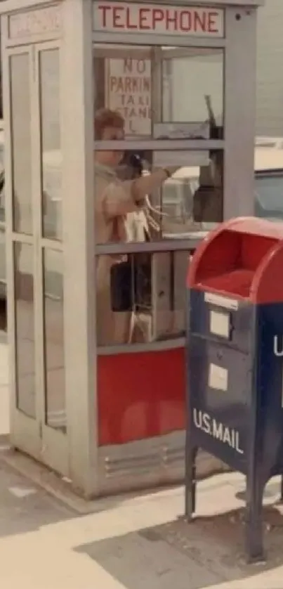 Vintage telephone booth and US mail box on a retro city street.