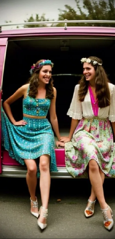 Retro fashion in front of a pink vintage van, showcasing floral dresses.