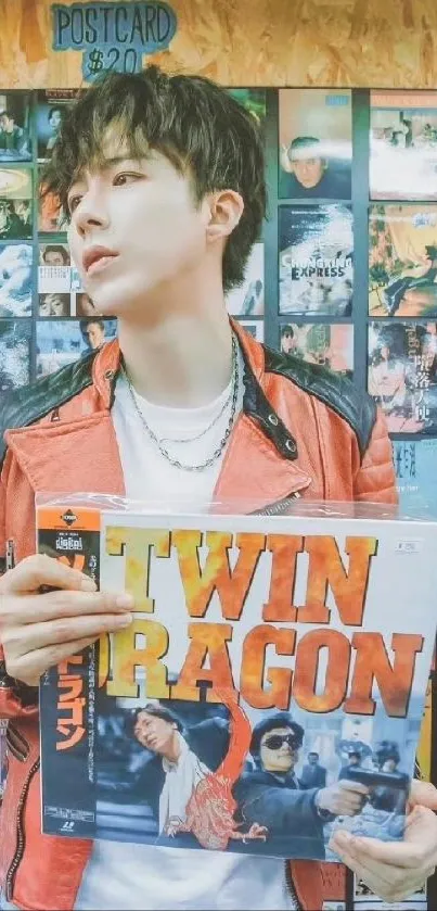 Person holding a vinyl record in a retro store setting with colorful shelves.