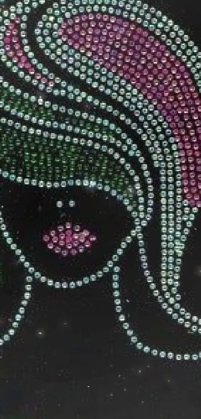 Rhinestone art with pink and green beads on a black background.