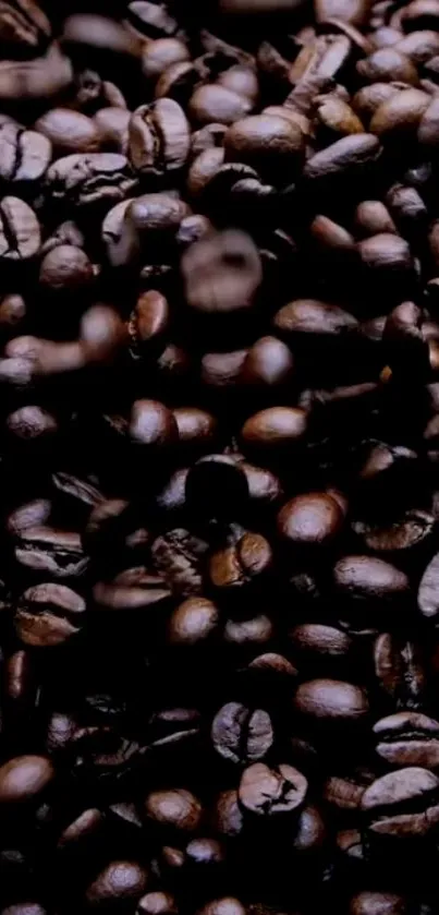 Close-up of dark brown coffee beans filling the frame with rich texture and warmth.