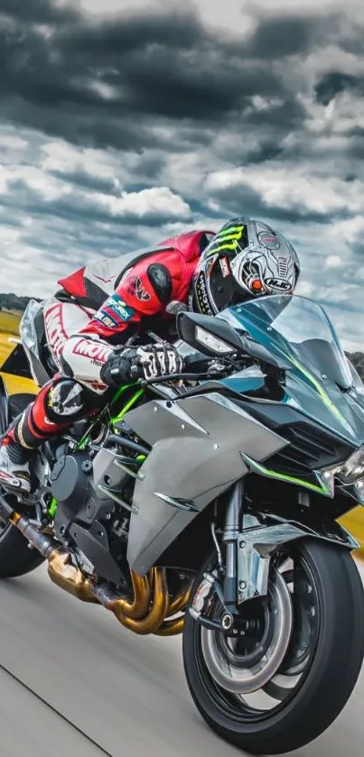 Motorcyclist racing sport bike on highway.