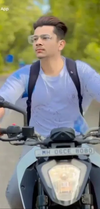 Young man riding motorbike through lush greenery.