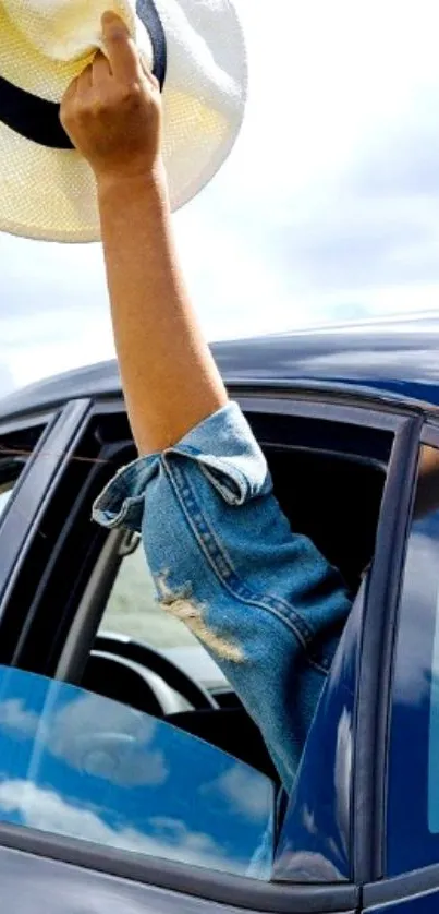 Arm extending from car with waving hat.