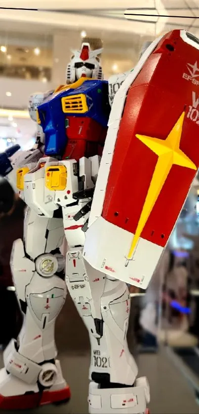 A vibrant robotic model with shield in a modern display setting.