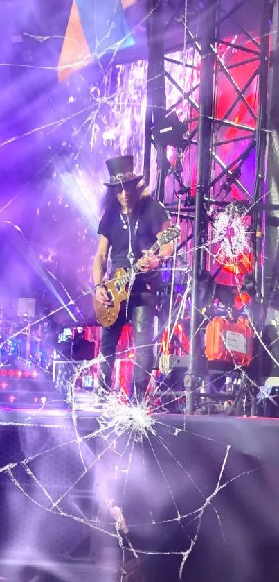 Guitarist performing on a vibrant purple-lit stage.