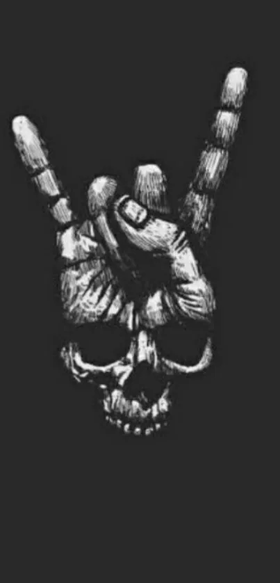 Black and white skull hand gesture on dark background.