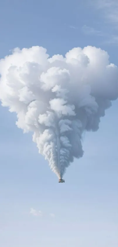 Heart-shaped cloud rising in a serene blue sky.