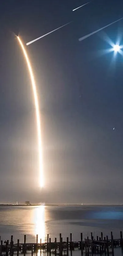 Rocket launch over ocean under a starry sky.