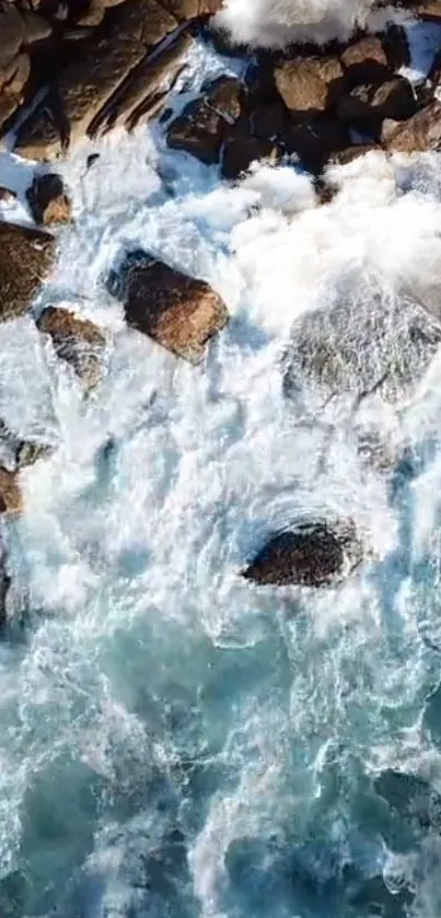 Aerial view of ocean waves crashing on rocks.