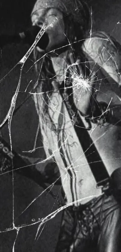 Black and white image of a rockstar with cracked glass effect.