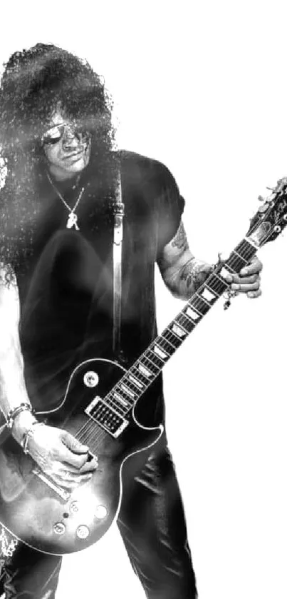 Black and white image of rockstar playing electric guitar.