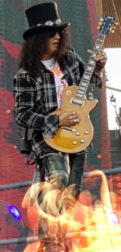 Rock guitarist performing on stage with electric guitar and plaid outfit.