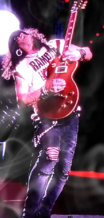 Guitarist performing energetically on stage with bright red guitar.