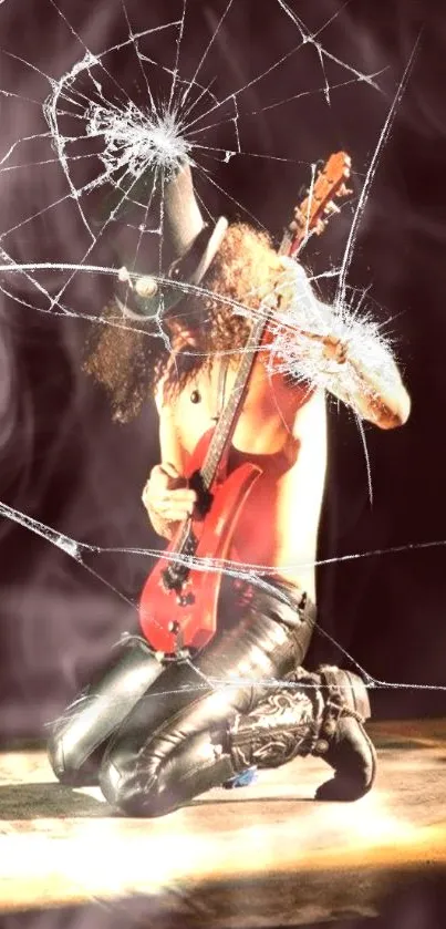 Guitarist in a hat, kneeling on stage with a red guitar, performing energetically.