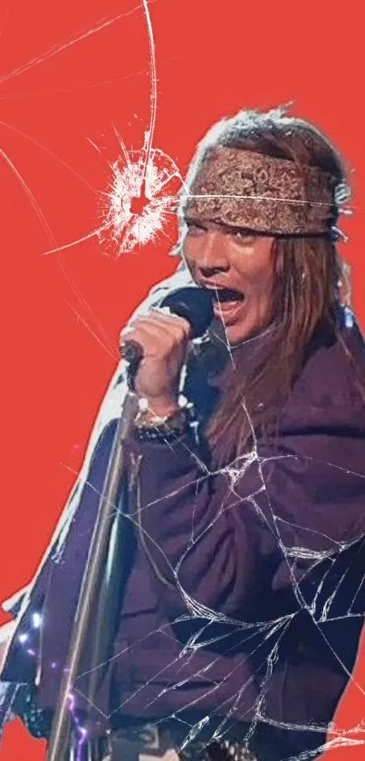 Rockstar performing with mic against a red cracked background.