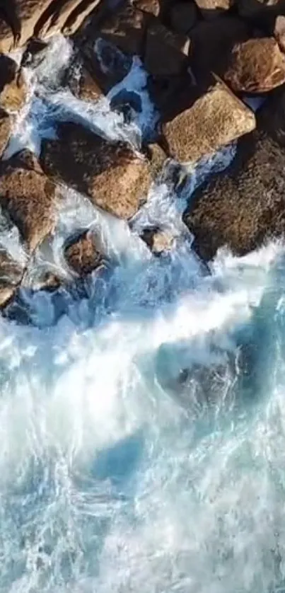 Aerial view of ocean waves crashing against rocky coastal shore.