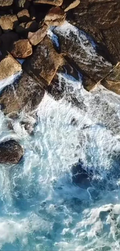 Aerial view of waves crashing against a rocky coastline.