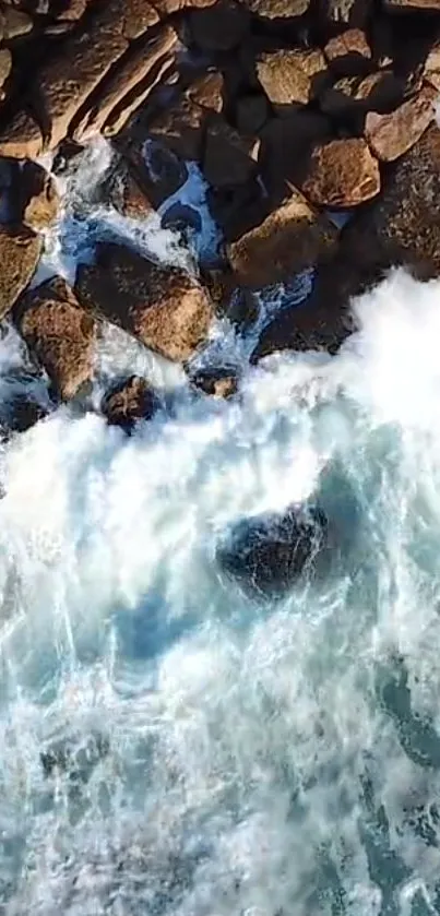 Aerial view of rocky coastline with crashing ocean waves.