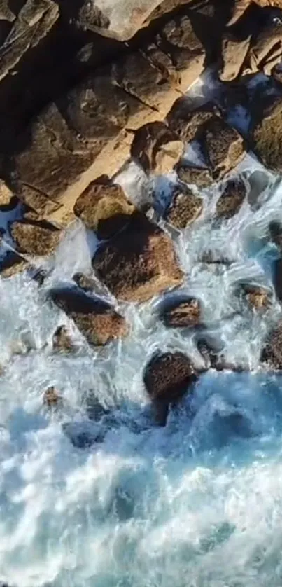 Aerial view of rocky coastline with crashing ocean waves.