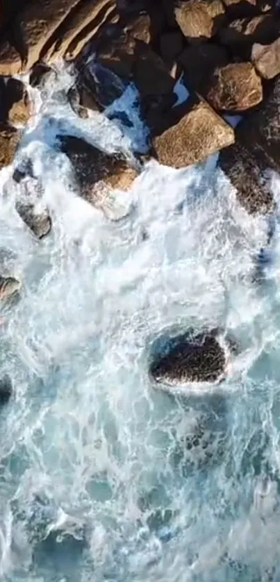 Aerial view of ocean waves crashing on a rocky coastline.