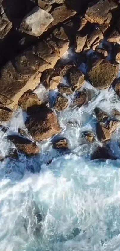 Waves crashing on a rocky coastline with vibrant blue water.