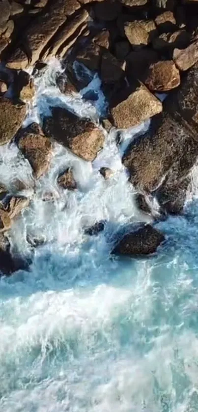 Aerial view of rocky ocean waves crashing on a shoreline.