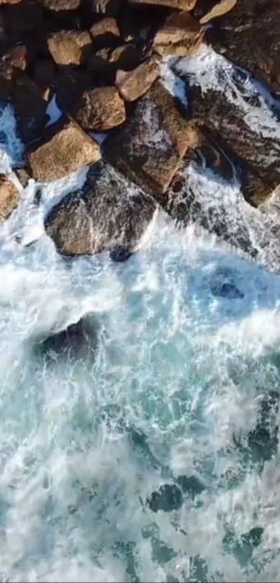 Ocean waves crashing against rocks with white foam.