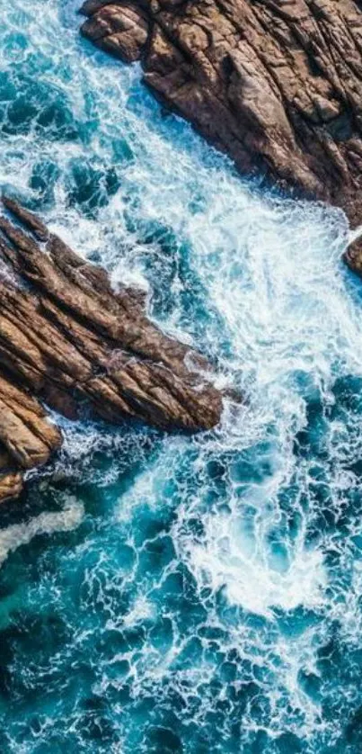 Aerial view of crashing ocean waves against rocky shore.