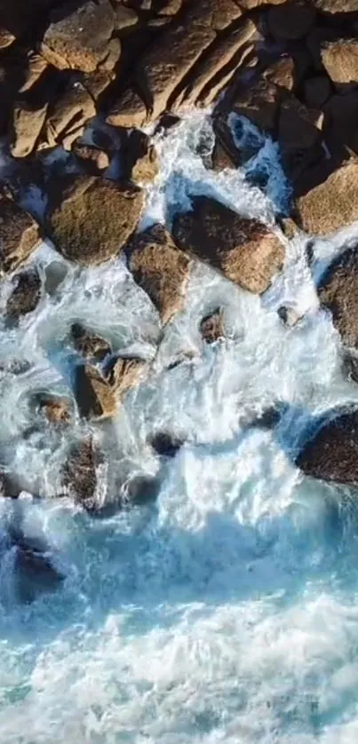 Aerial view of rocky shoreline with waves.