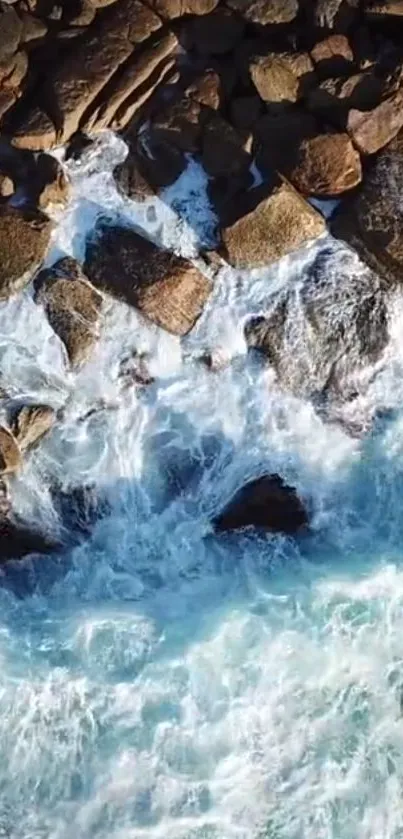 Aerial view of rocky coastline with crashing ocean waves.