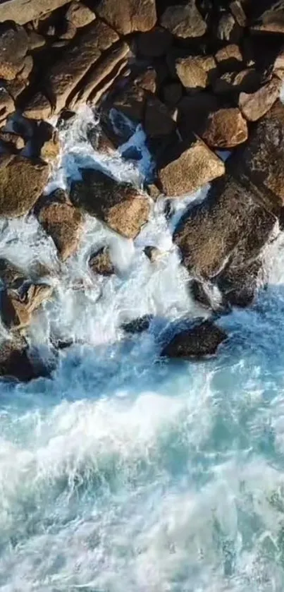 Aerial view of waves crashing on a rocky shoreline.