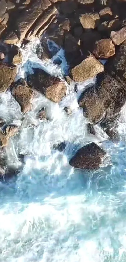 Aerial view of coastal rocks with ocean waves crashing.