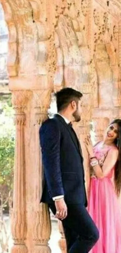 Couple in love standing under ornate archways.